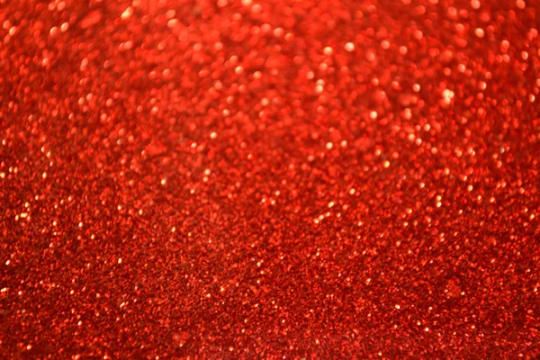 Bright and abstract blurred red background with shimmering glitter — Stock Photo, Image