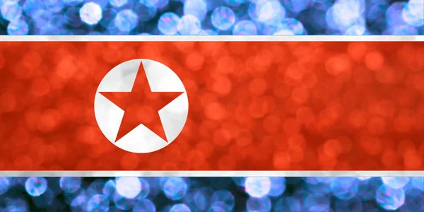 The National flag of Democratic People's Republic of Korea made of bright and abstract blurred backgrounds with shimmering glitter — Stock Photo, Image