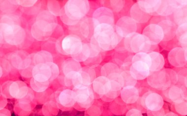Parıldayan ile parlak ve soyut pembe arka plan bulanık glitter