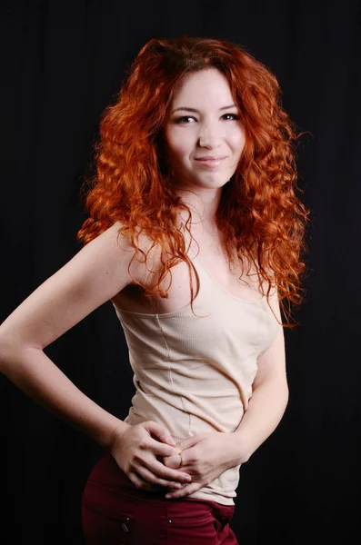 Beautiful young redhead woman with perfect daytime makeup and long silver earrings smiling — Stock Photo, Image