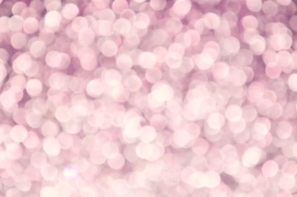 キラキラ輝くと明るく抽象のぼやけたピンクの背景 — ストック写真