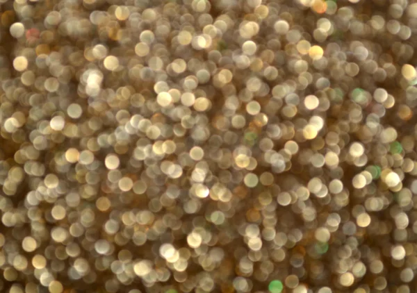 Helder en abstracte wazig sterren gouden achtergrond met glinsterende glitter — Stockfoto