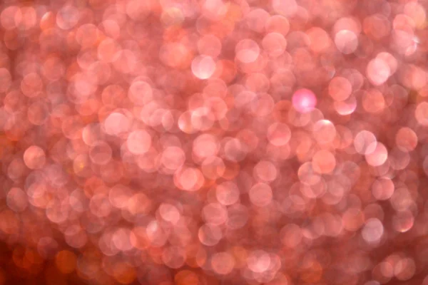 光明和抽象模糊粉红色背景与波光粼粼闪光 — 图库照片