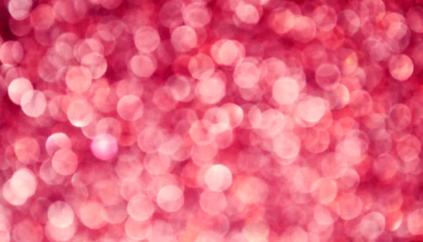 光明和抽象模糊粉红色背景与波光粼粼闪光 — 图库照片
