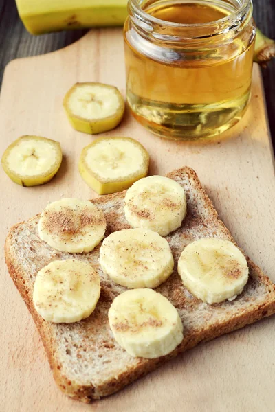 Healthy toast with banana, cinnamon and honey — Stock Photo, Image