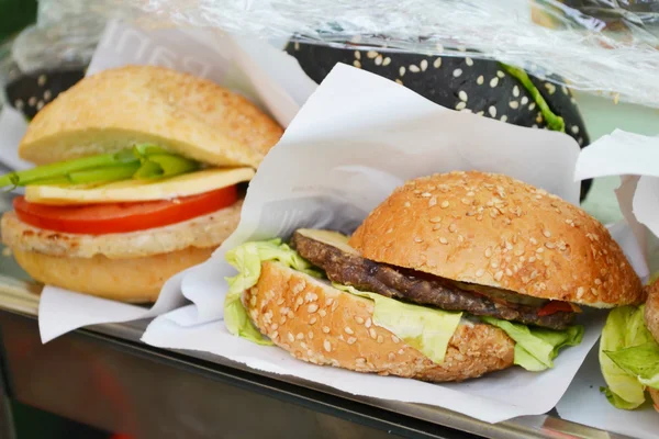 Tasty burger with meat, salad and tomato — Stock Photo, Image