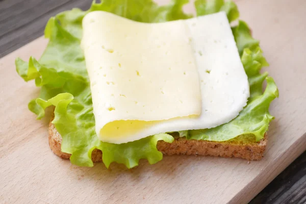 Big vegetarian sandwich with cheese and lettuce salad — Stock Photo, Image