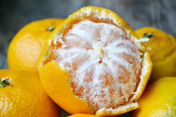 Sweet and bright tangerines on wooden table — Stock Photo, Image