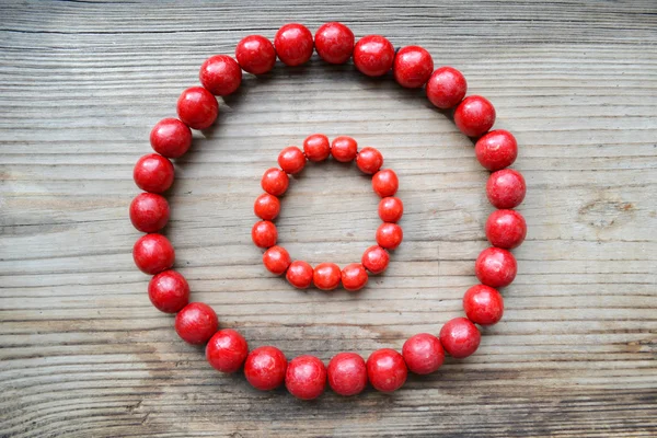 Traditional Ukrainian round red bead made from wood — Stock Photo, Image