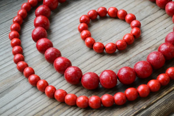 Traditional Ukrainian round red bead made from wood — Stock Photo, Image