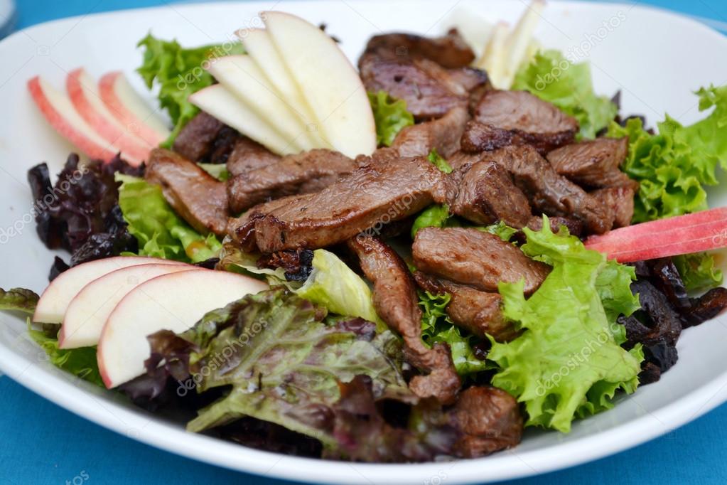 Tasty salad with apples and duck fillet