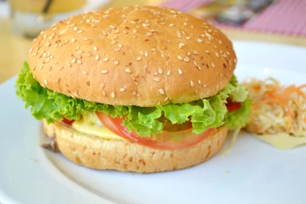 Tasty burger with meat, salad and tomato — Stock Photo, Image