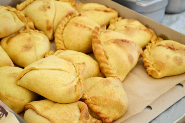 Lots of tasty fried patty buns stuffed with a variety of fillings — Stock Photo, Image