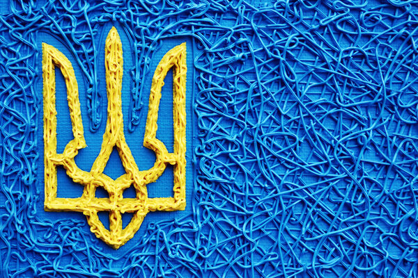 The ukrainian trident in national yellow and blue colours - a symbol of Ukraine