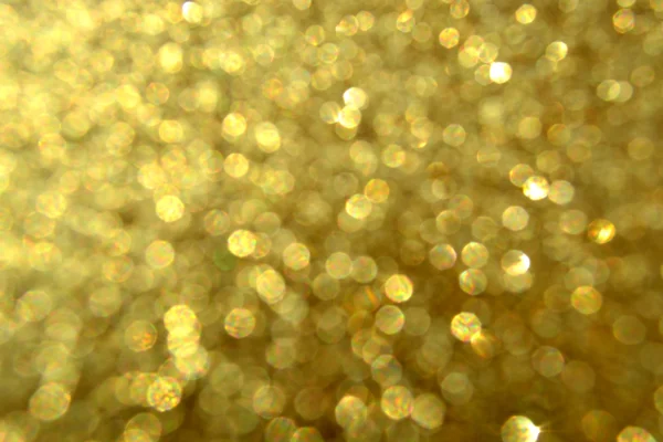 Bright and abstract blurred star golden background with shimmering glitter — Stock Photo, Image