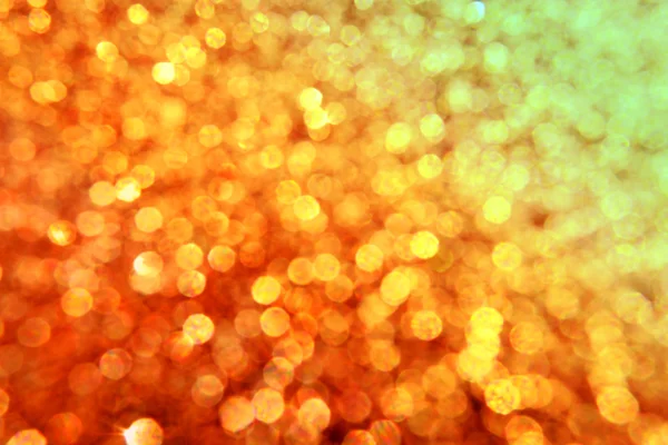 Brilhante e abstrato desfocado estrela dourada fundo com brilho cintilante — Fotografia de Stock