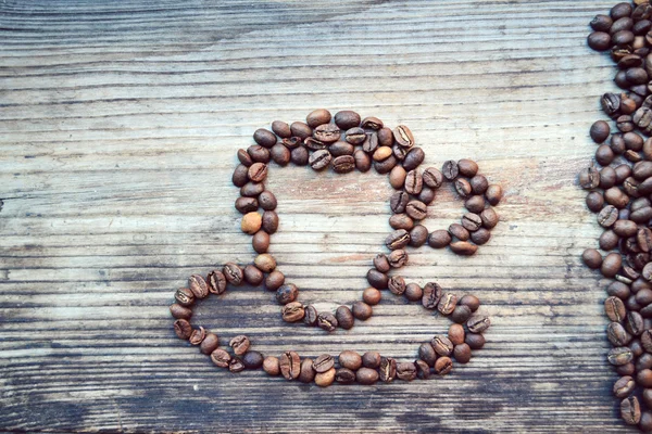 Tasse ou tasse faite de beaucoup de grains de café torréfiés — Photo