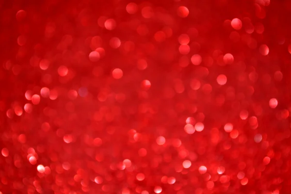 Fundo vermelho embaçado brilhante e abstrato com brilho cintilante — Fotografia de Stock