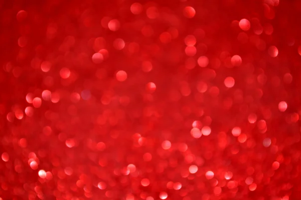 Bright and abstract blurred red background with shimmering glitter — Stock Photo, Image