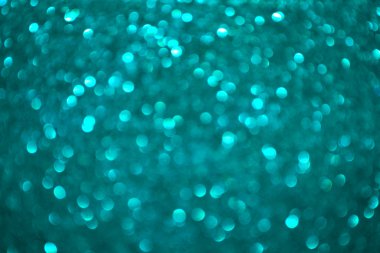Parlak ve soyut bulanık deniz mavi arka plan ile parıldayan glitter