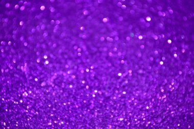 Parıldayan ile parlak ve soyut parlak mor arka plan bulanık glitter