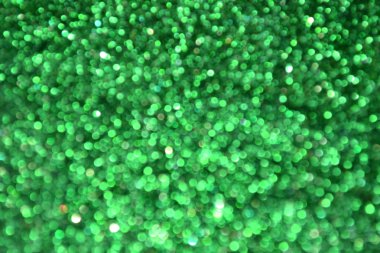 Parıldayan ile parlak ve soyut yeşil arka plan bulanık glitter