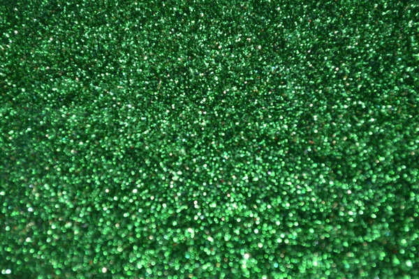 Bright and abstract blurred green background with shimmering glitter — Stock Photo, Image