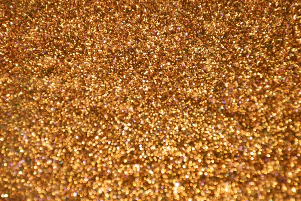 Brillante y abstracta estrella borrosa fondo dorado con brillo brillante — Foto de Stock