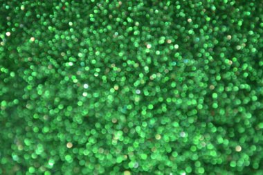 Parıldayan ile parlak ve soyut yeşil arka plan bulanık glitter