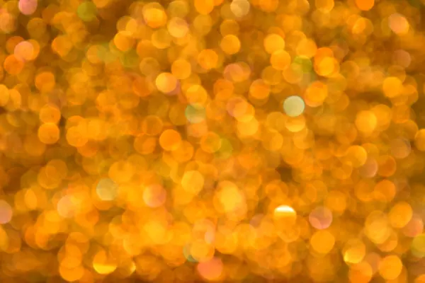 Helle und abstrakte verschwommene Sterne goldener Hintergrund mit schimmerndem Glitzern — Stockfoto