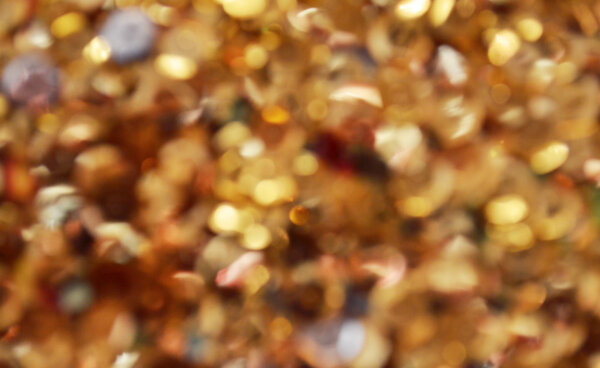 Bright and abstract blurred star golden background with shimmering glitter