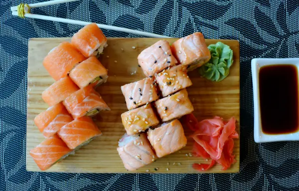 Delicious rolls and sushi with eel, salmon and cream cheese — Stock Photo, Image