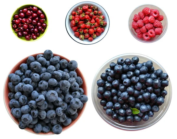 stock image A lot of bright strawberries, raspberries, cherries and blueberries isolated on white