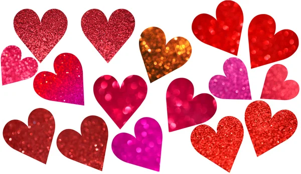 Bright and abstract blurred red, pink and violet hearts with shimmering glitter isolated on white — Stock Photo, Image