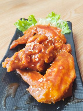 Restaurant Quality Glazed Sticky Chicken Appetizer Served on Rustic Wooden Background