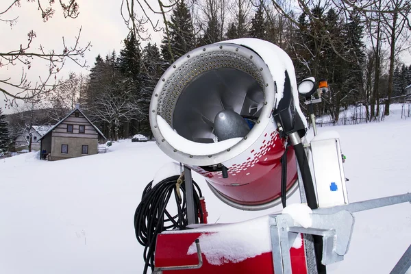 Snow making machine on piste at ski resort in snowy country — Stock Photo, Image