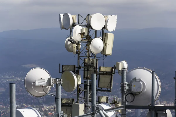 Bunch of transmitters and aerials on telecommunication tower — Stock Photo, Image