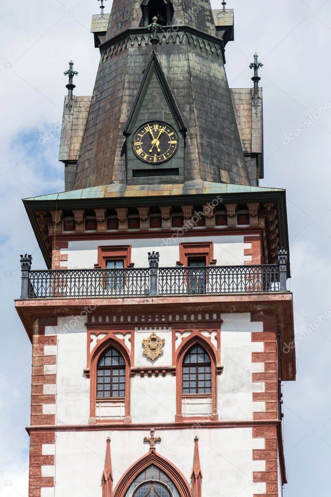 Sightseeing tower of the late gothic decanal Church of the Assumption of the Virgin Mary in Chomutov, Usti nad Labem region, Krusne hory, Ore Mountains, Czech Republic, sunny summer day, clear blue sky background