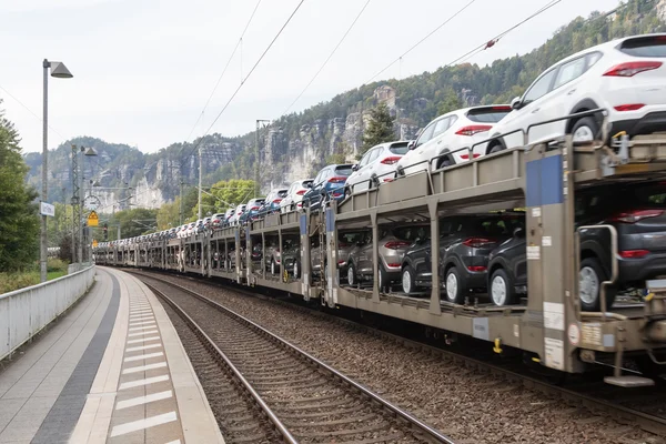 Transporting cars by rail