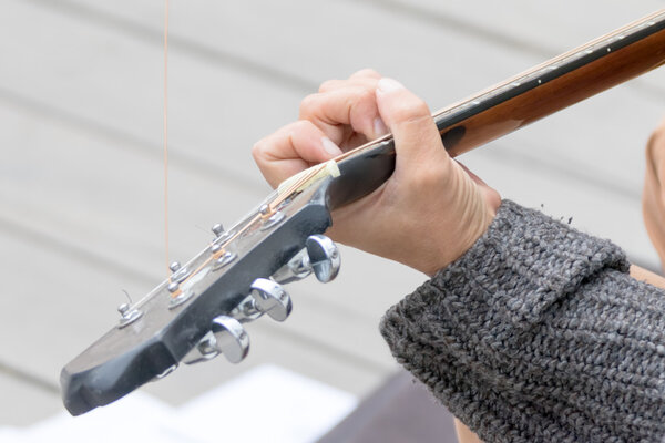 man holding guitar