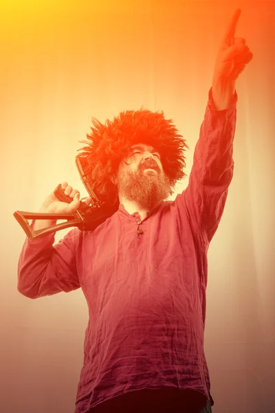 Bearded man with gun — Stock Photo, Image