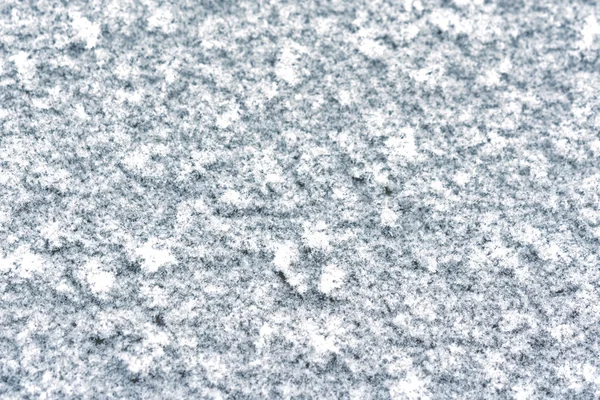 Snowflakes on the ground in winter — Stock Photo, Image