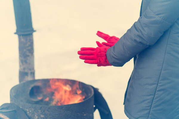 A woman in a bright pink gloves