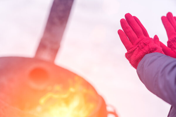 A woman in a bright pink gloves