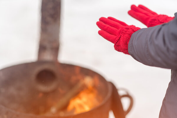 A woman in a bright pink gloves