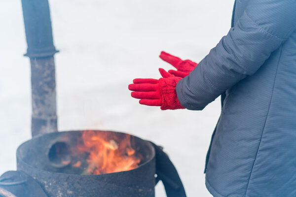 A woman in a bright pink gloves