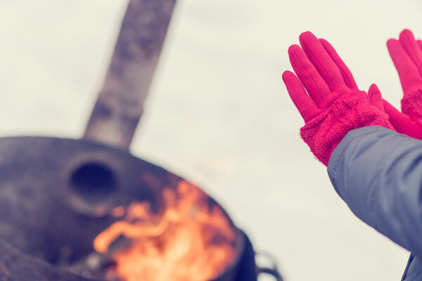 A woman in a bright pink gloves