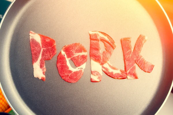 De inscriptie varkensvlees op de teflon — Stockfoto