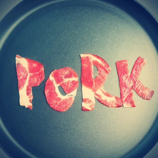 Inscriptie varkensvlees op de teflon — Stockfoto