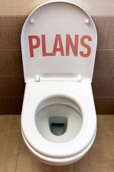 Toilet with an inscription "Plans" — Stock Photo, Image